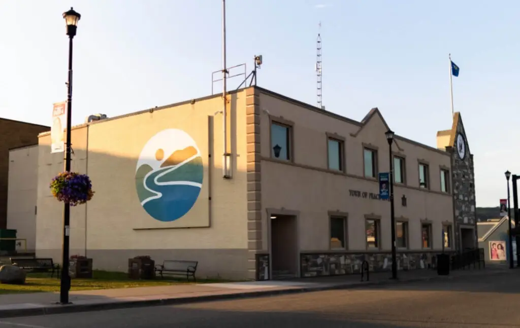 Town hall building with mural and flag