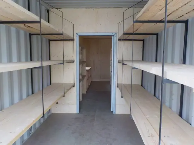 Empty wooden shelves inside storage container