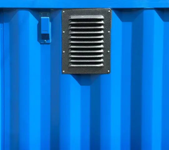 Blue metal wall with vent and switch